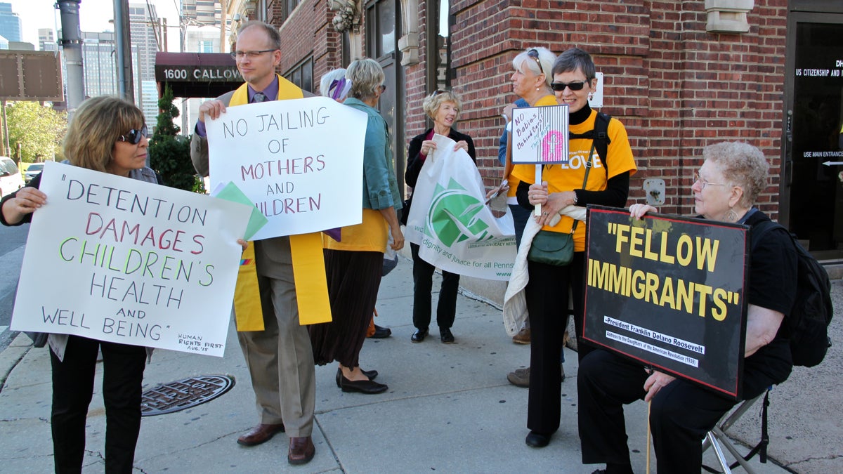  Unitarian-Universalists clergy and lay leaders from Reading and Philadelphia demonstrate outside the  Immigration and Customs Enforcement (ICE) building on Callowhill Street. The group is protesting detention of undocumented mothers and children in the Berks County Family Detention Center. (Emma Lee/WHYY) 