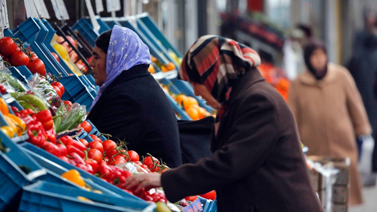  Women wearing head scarves buy fruit in a street in Duisburg, Germany. ( AP Photo/Frank Augstein) 