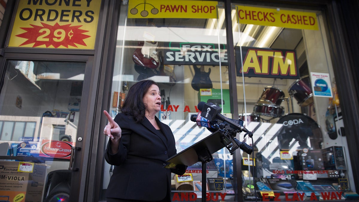  Beth Grossman, a Republican, announces her candidacy for Philadelphia district attorney in front of a pawn shop on Kensington Avenue. The storefront near the Allegheny SEPTA station is the same location where her parents ran a candy shop years ago.  (Lindsay Lazarski/WHYY)    