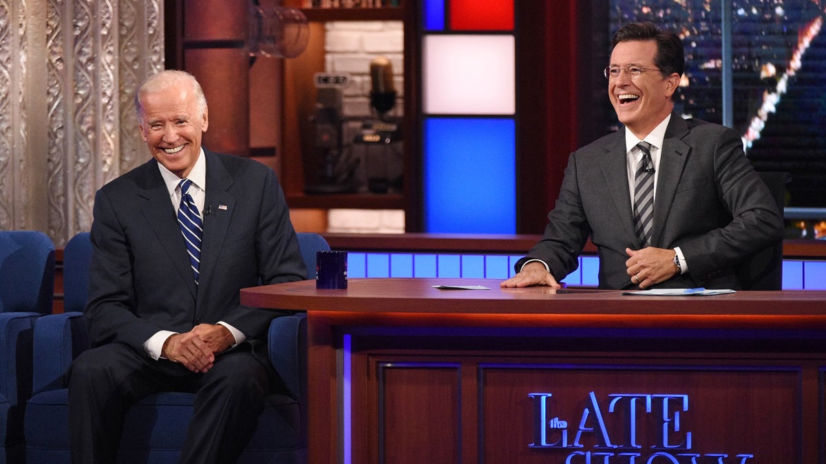  In this image released by CBS, host Stephen Colbert, right, laughs with Vice President Joe Biden during a taping of 