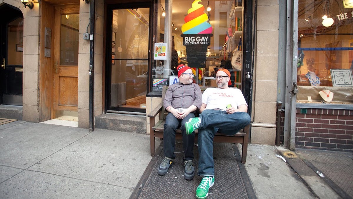  Business partners and life partners, and Big Gay Ice Cream co-founders, Bryan Petroff and Doug Quint are shown sitting in front of their East Village location, 125 E 7th Street, in New York City. (Image courtesy of Donny Tsang) 