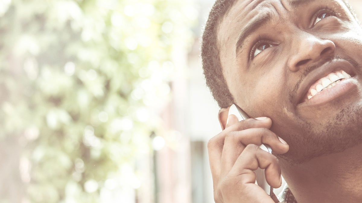 (<a href='http://www.bigstockphoto.com/image-134919275/stock-photo-young-african-american-man-using-mobile-phone-makes-a-call-close-up-on-face'>Big Stock Photo</a>)