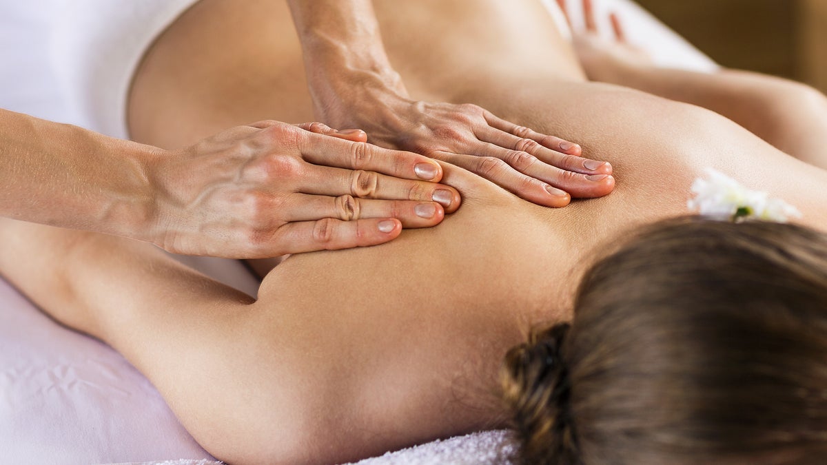 (Kotin/<a href='http://www.bigstockphoto.com/image-112333736/stock-photo-woman-enjoying-massage'>Big Stock Photo</a>)