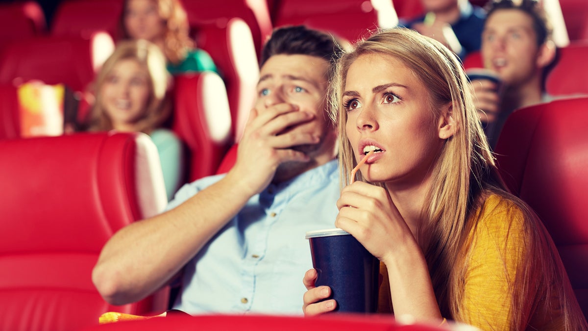 (<a href='http://www.bigstockphoto.com/image-109769333/stock-photo-cinema%2C-entertainment-and-people-concept-couple-drinking-soda-and-watching-horror%2C-drama-or-thriller-movie-in-theater'>Bigstockphoto.com</a>)