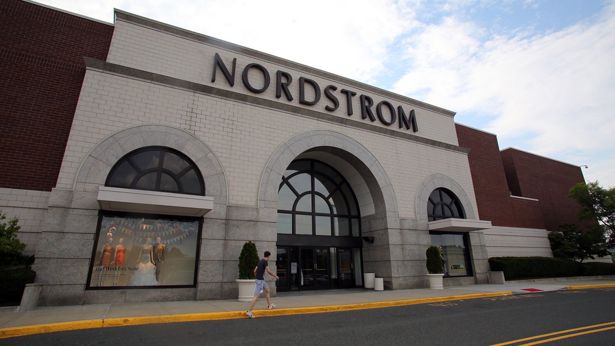 Shoppers walk past a Nordstrom department store in Paramus