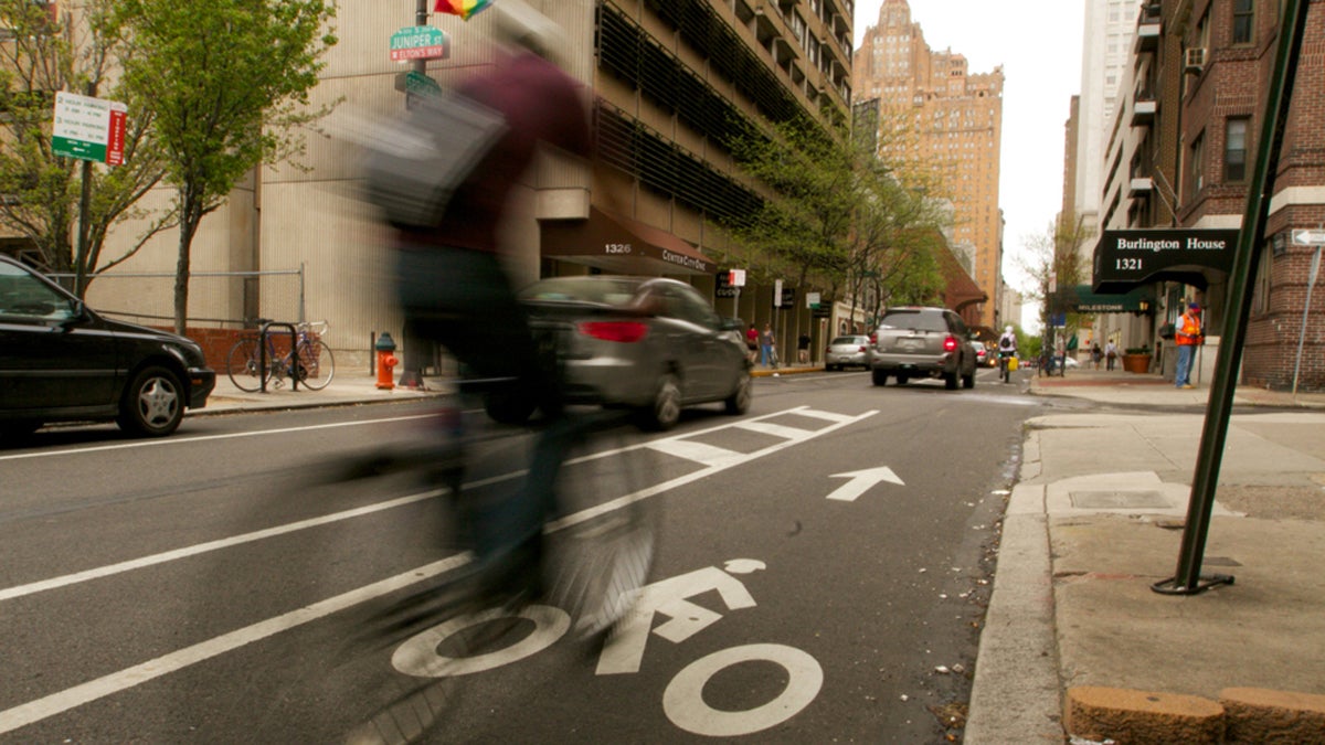  A cyclist heads west on Spruce Street toward Broad Street in Center City Philadelphia. (Nathaniel Hamilton/for NewsWorks) 