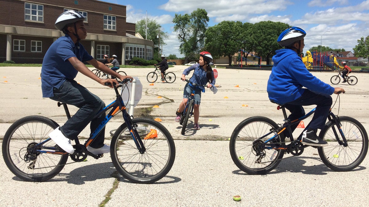 Students at Garfield Elementary School in Kansas City learn bicycle safety skills under the aegis of BikeWalkKC. (Alex Smith/for WHYY)
