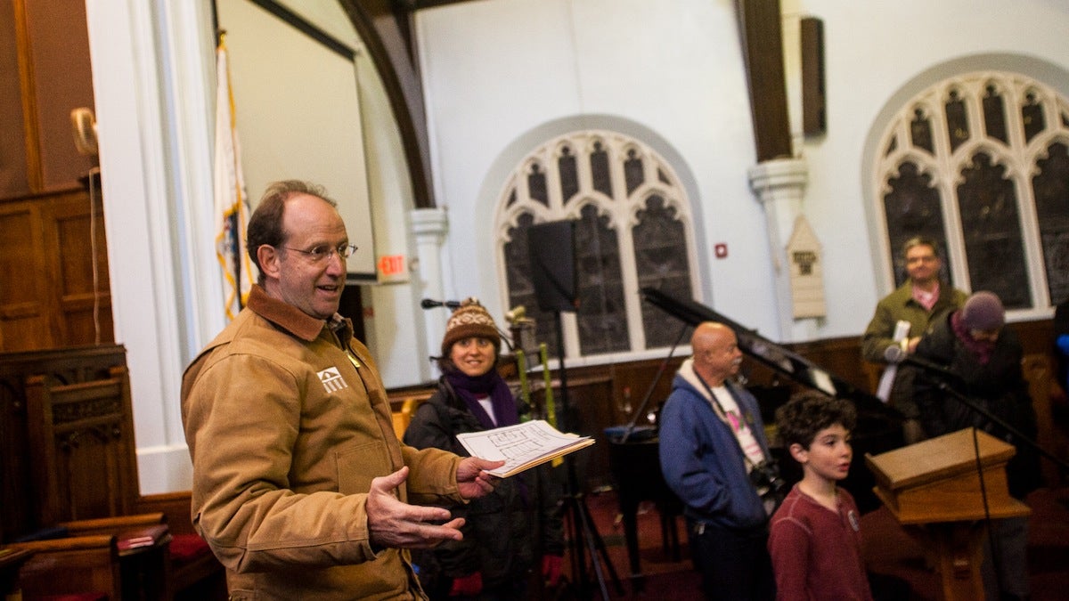 Local Developer Ken Weinstein addresses community members before touring the building attached to Mount Airy Presbyterian Church. (Brad Larrison/for NewsWorks)