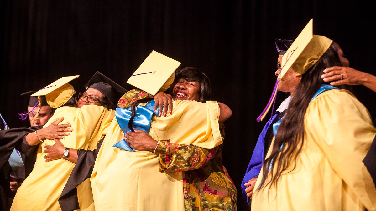 Former Germantown High Principal Margaret Mullen-Bavwidinsi greeted former students on stage. (Brad Larrison/for NewsWorks)