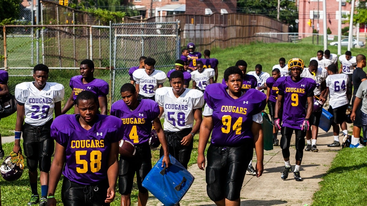 Three days before the season opener against Coatesville High School the Cougars make their way to the practice field. (Brad Larrison/for NewsWorks)
