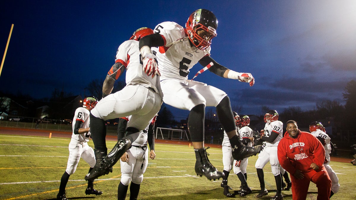 Deandre Scott and Mike Waters get airborne after Imhotep's 20-0 win over Berks Catholic. (Brad Larrison/for NewsWorks) 