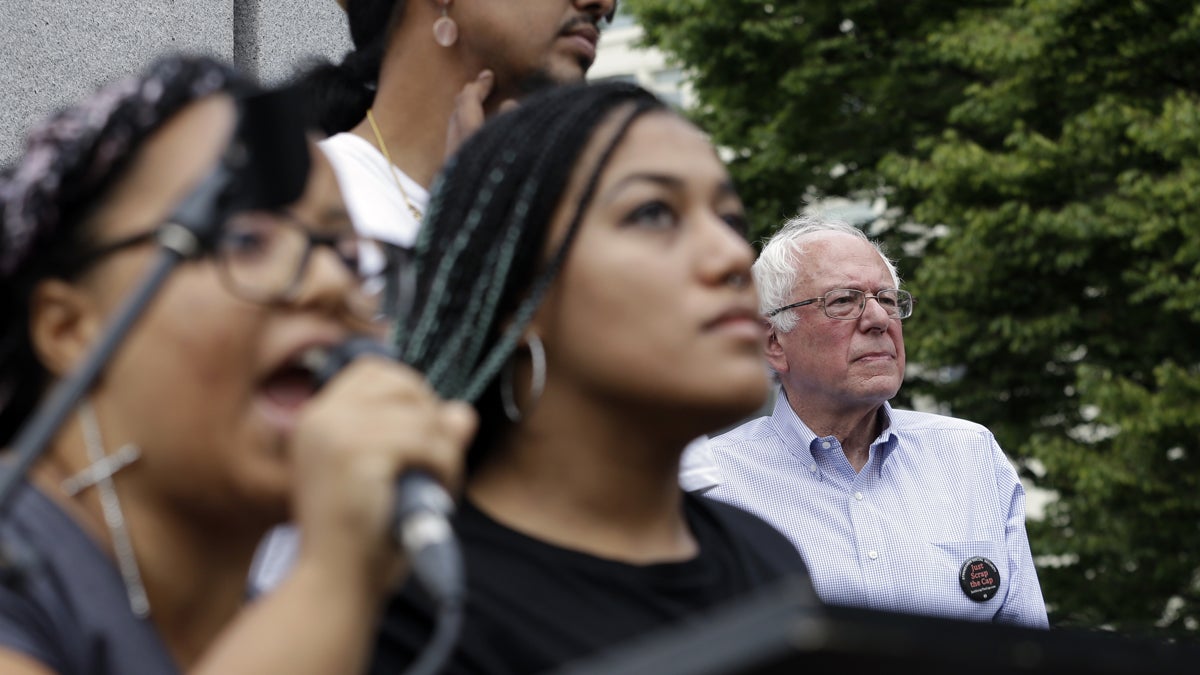  Marissa Johnson, left, speaks as Mara Jacqueline Willaford stands with her. Democratic presidential candidate Sen. Bernie Sanders, I-Vt., stands nearby as the two women take over the microphone at a rally Saturday, Aug. 8, 2015, in downtown Seattle. The women, co-founders of the Seattle chapter of Black Lives Matter, took over the microphone moments after Sanders began speaking. Sanders eventually left the stage without speaking further. (AP Photo/Elaine Thompson) 
