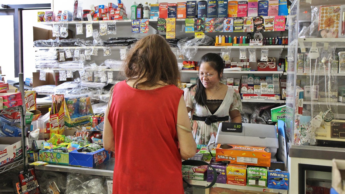  Chan Qyng, the owner of corner store New Matt's Market (1427 S 6th St., in Philadelphia), is always behind the counter. Gallup finds that Americans have a lot of confidence in small business as an American institution. (Kimberly Paynter/WHYY) 