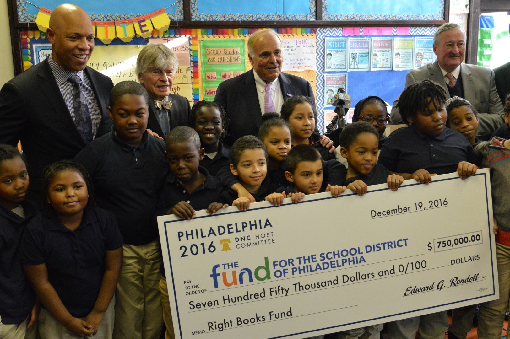 Officials with the Democratic National Committee and the School District of Philadelphia join students in celebrating the $750