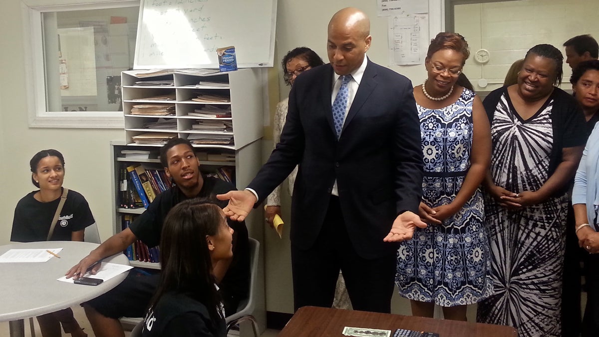  U.S. Sen. Cory Booker and Camden Mayor Dana Redd announce the award of a $1.1 million grant to the YouthBuild job training program. (Tom MacDonald/WHYY) 