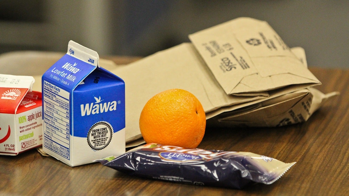 Student breakfast at Penn Wood Middle School consists of a carton of juice, carton of milk, a piece of fruit, and a grain. (Kimberly Paynter/WHYY)