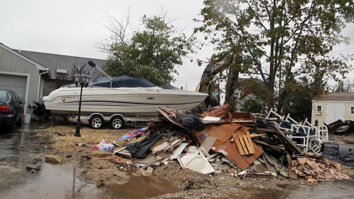  Demolition work continues in a Brick Township neighborhood where homes suffered flood damage from Sandy. (Phil Gregory/for NewsWorks) 