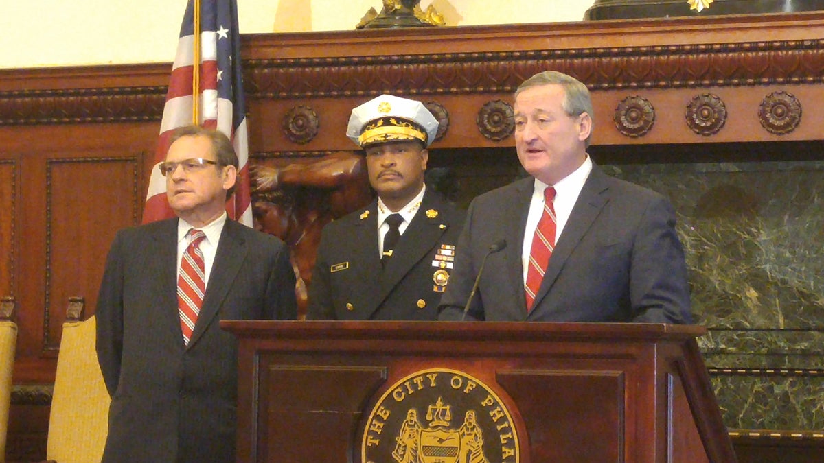  With City Controller Alan Butkovitz, left, and acting Fire Commissioner Derrick Sawyer at his side, Mayor Jim Kenney Thursday formally announces the end of the brownout policy for city fire stations. (Tom MacDonald/WHYY) 