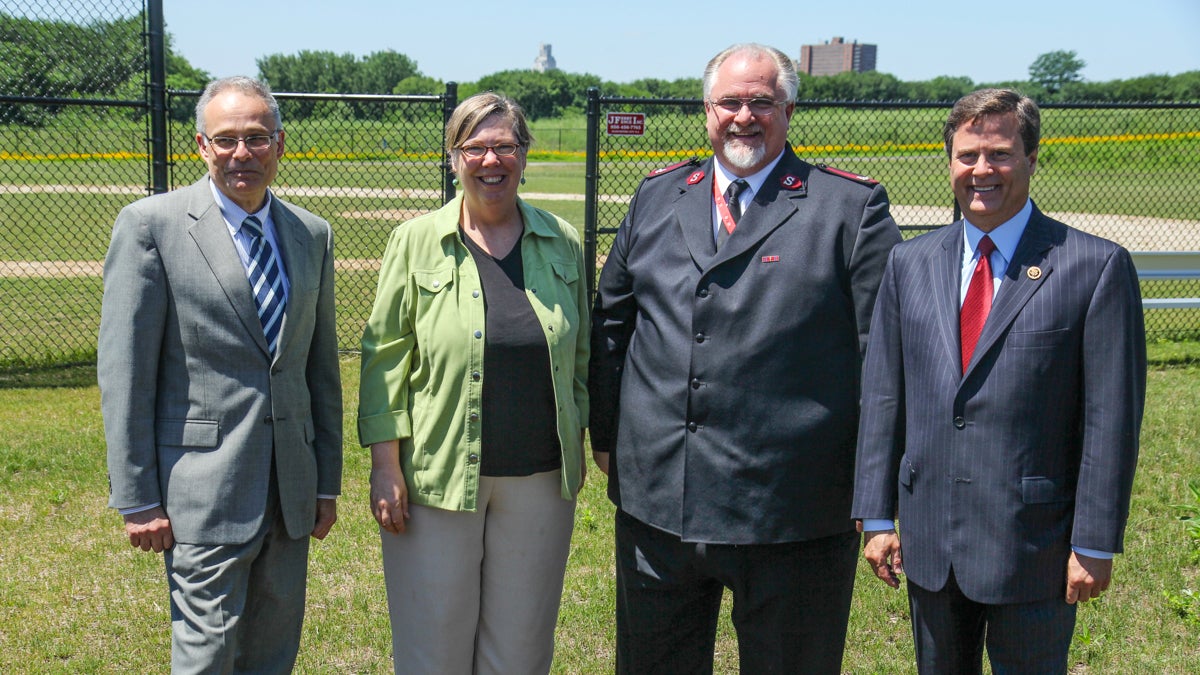  Officials (from left) Jim Harveson, director of Economic Development, Camden Redevelopment Agency, Judith A. Enck, EPA regional administrator, Salvation Army Maj. Paul Cain, and N.J. Congressman Donald Norcross announce funding Monday for brownfield cleanups in Camden. (Kimberly Paynter/WHYY) 