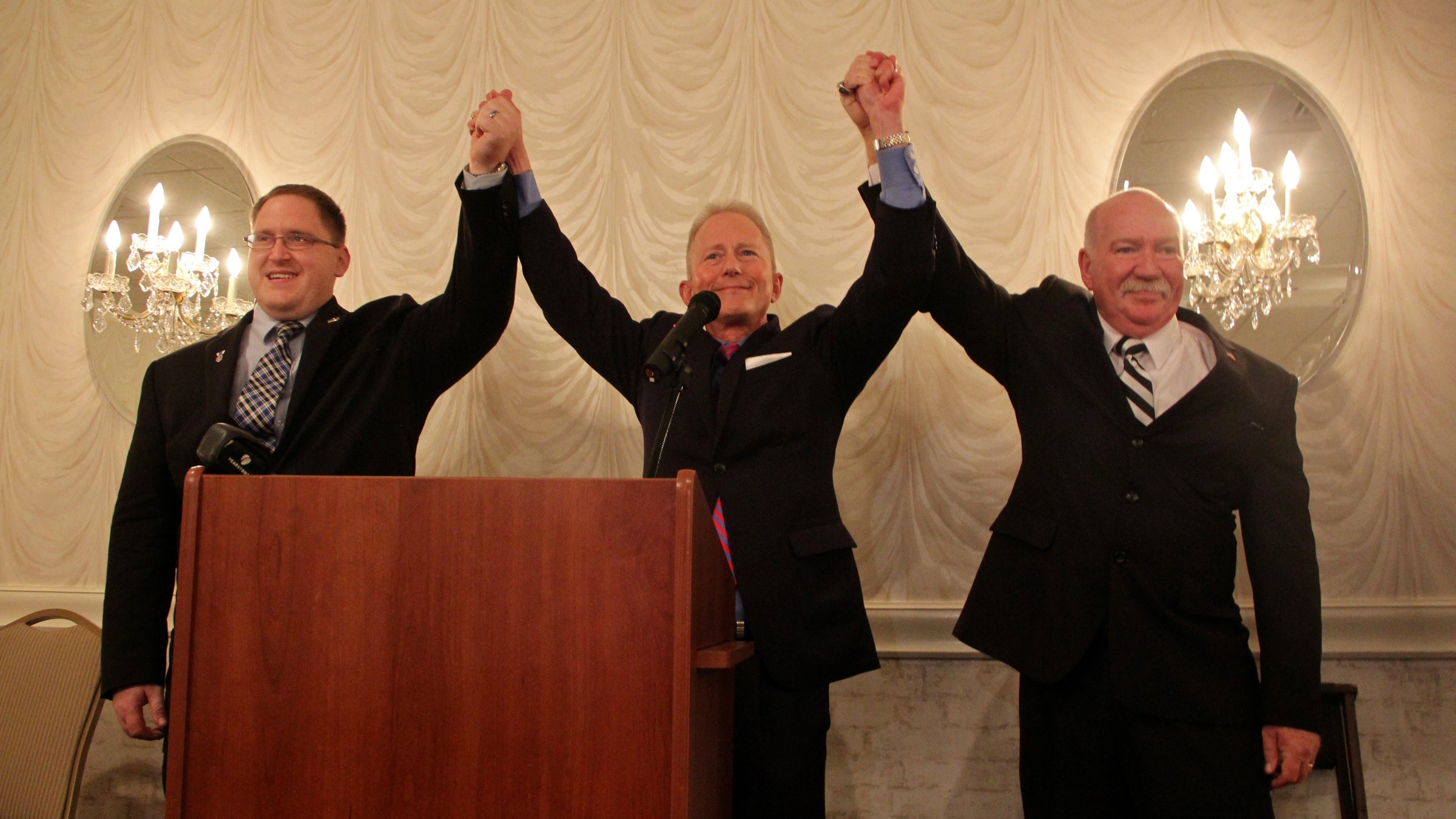  Democratic Assemblyman-elect Bruce Land (right) celebrates his victory over one-term incumbent Sam Fiocchi in New Jersey's 1st District. He is joined by incumbent Assemblyman Bob Andrzejczak (left) and state Sen. Jeff Van Drew. (Emma Lee/WHYY) 