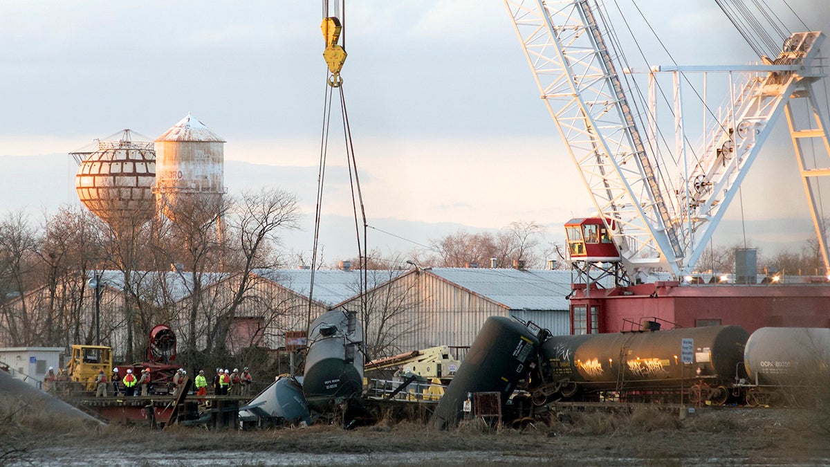  A crane lifts up the first car at the derailment site in Paulsboro, New Jersey, following the Nov. 30, 2012, derailment. (Bas Slabbers/for NewsWorks) 
