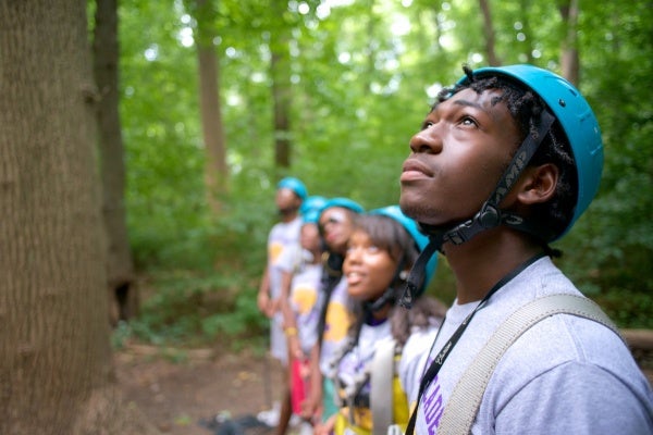  Students from MLK and GHS watch classmates on the ropes course as part of the Outward Bound program. (Bas Slabbers/for NewsWorks) 