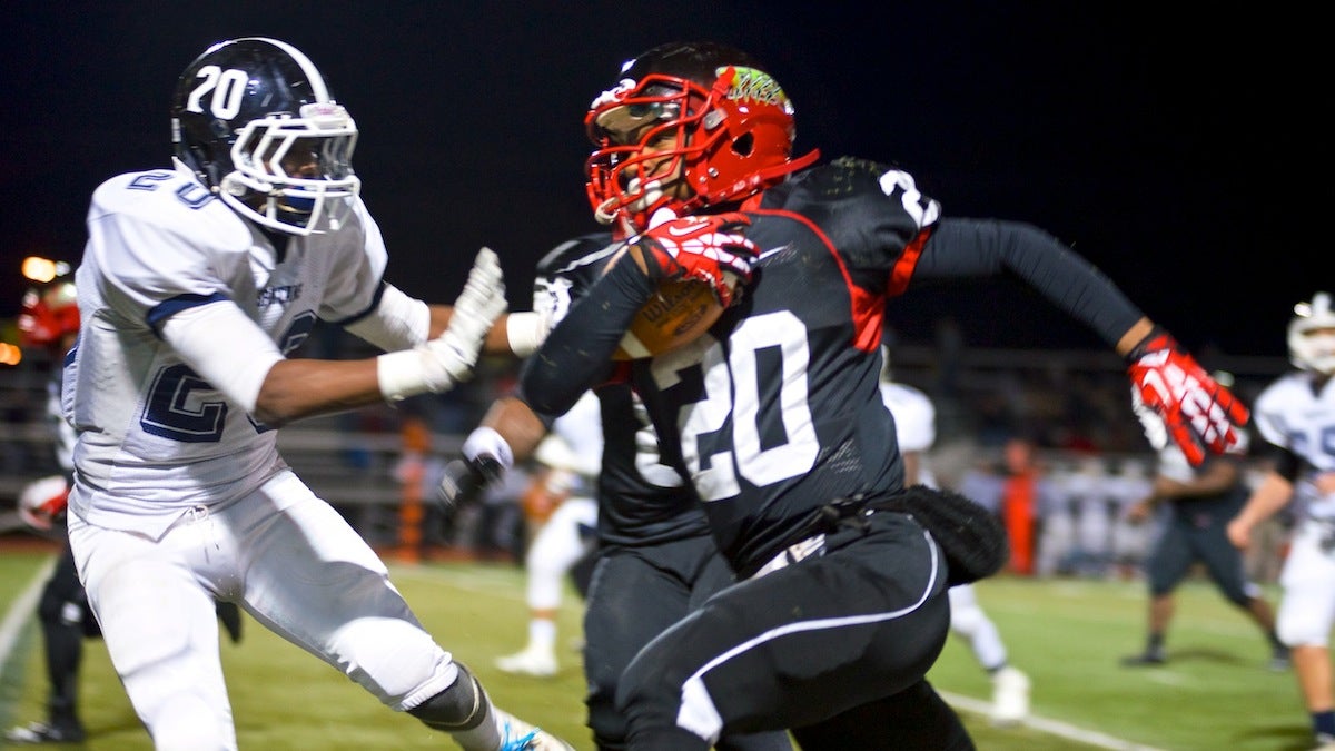  Imhotep's Nasir Bonner (with ball) helped his team blow out Springfield Twp. on Saturday night despite captain Khalif Hopkins-Bey's best efforts. (Bas Slabbers/for NewsWorks) 