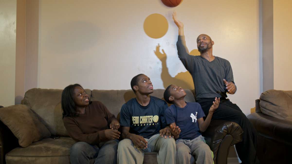  The Isaac family jokes around inside their South Philadelphia home. (Bas Slabbers/for NewsWorks) 