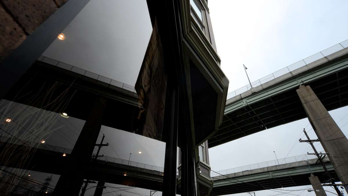  The Route 1 bridges, as seen reflected in the window of 4141 Ridge Ave. (Bas Slabbers/for NewsWorks) 