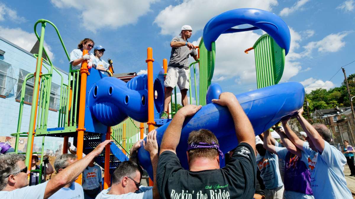  Volunteers come together to build a playground at Manayunk's North Light Community Center on Tuesday. (Bas Slabbers/for NewsWorks) 
