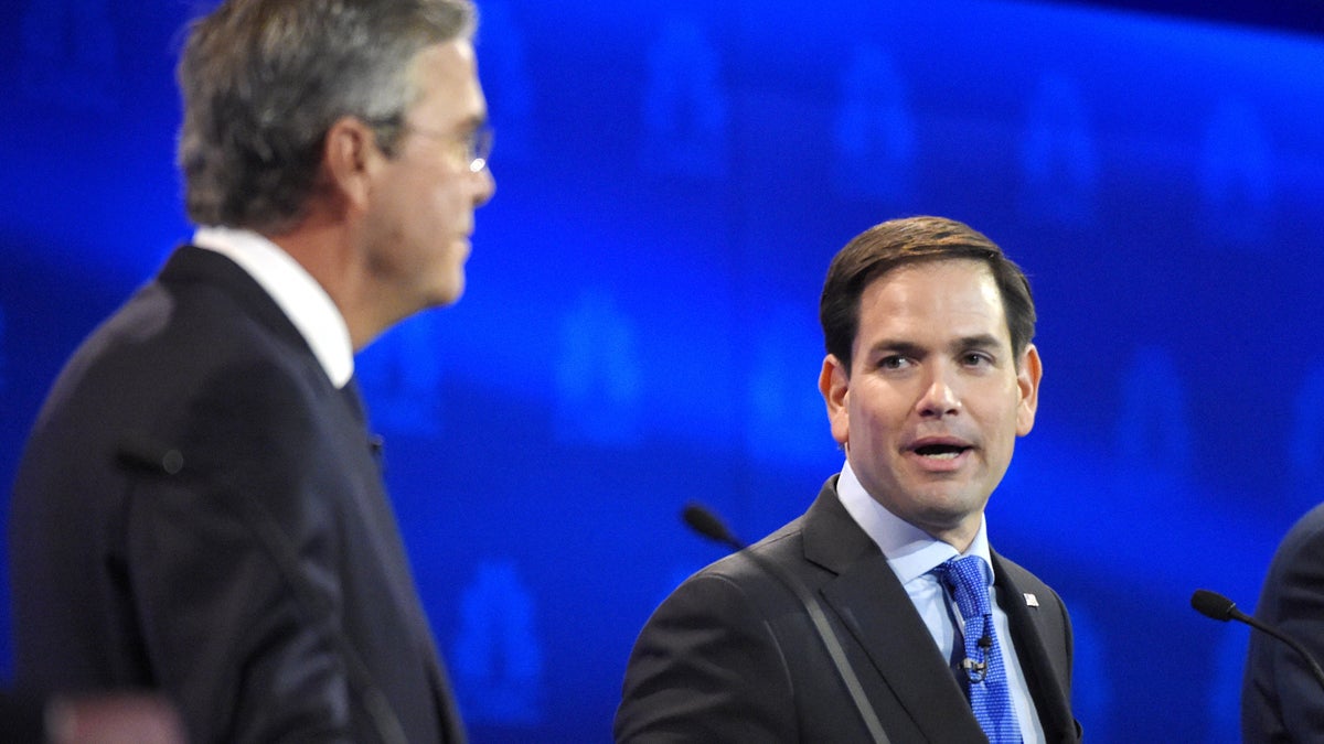  Marco Rubio, right, and Jeb Bush, argue a point during the CNBC Republican presidential debate at the University of Colorado, Wednesday, Oct. 28, 2015, in Boulder, Colo. (AP Photo/Mark J. Terrill) 