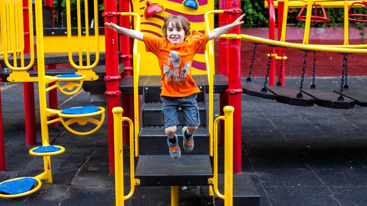 jame Byiers, 4, plays at the playground where he will attend public school  at C.W. Henry after his parents, Jennifer and Chris, weighed their options with charter and private schools. (Brad Larrison/for NewsWorks)