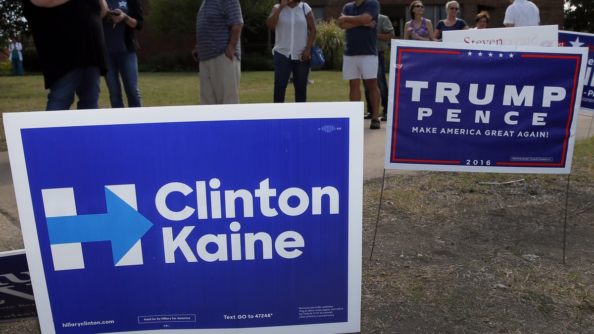 Campaign signs are shown in Dallas. (AP Photo/Tony Gutierrez