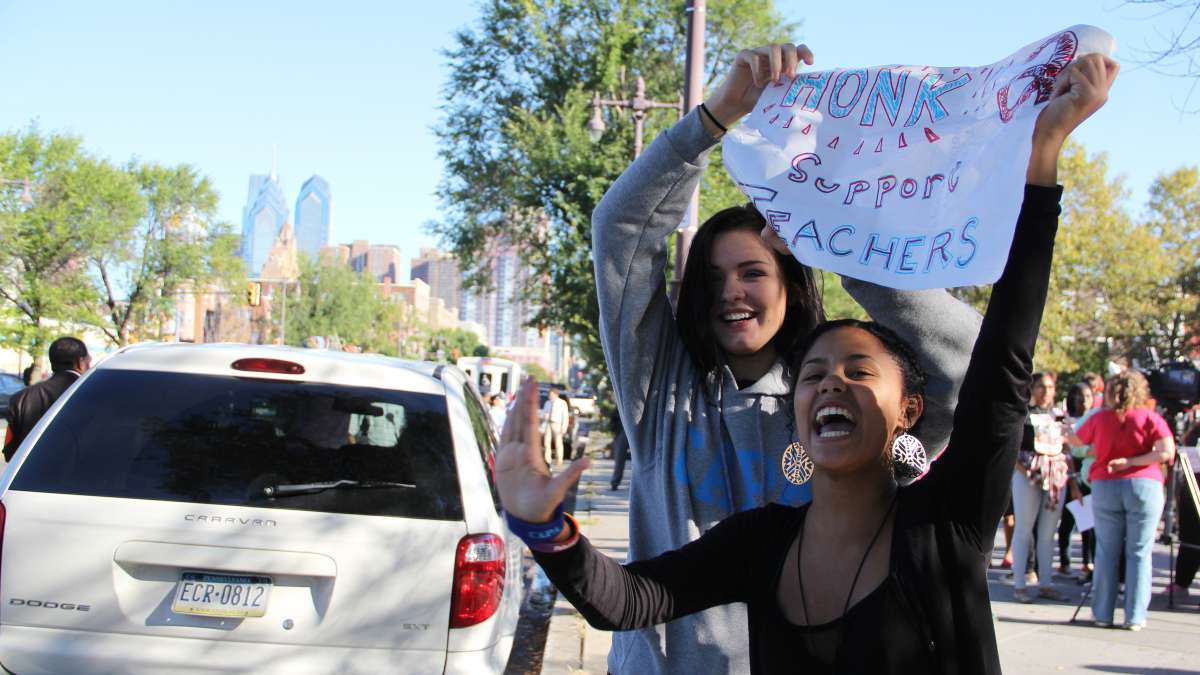 Students get support from passing motorists on South Broad Street during an Oct. 8