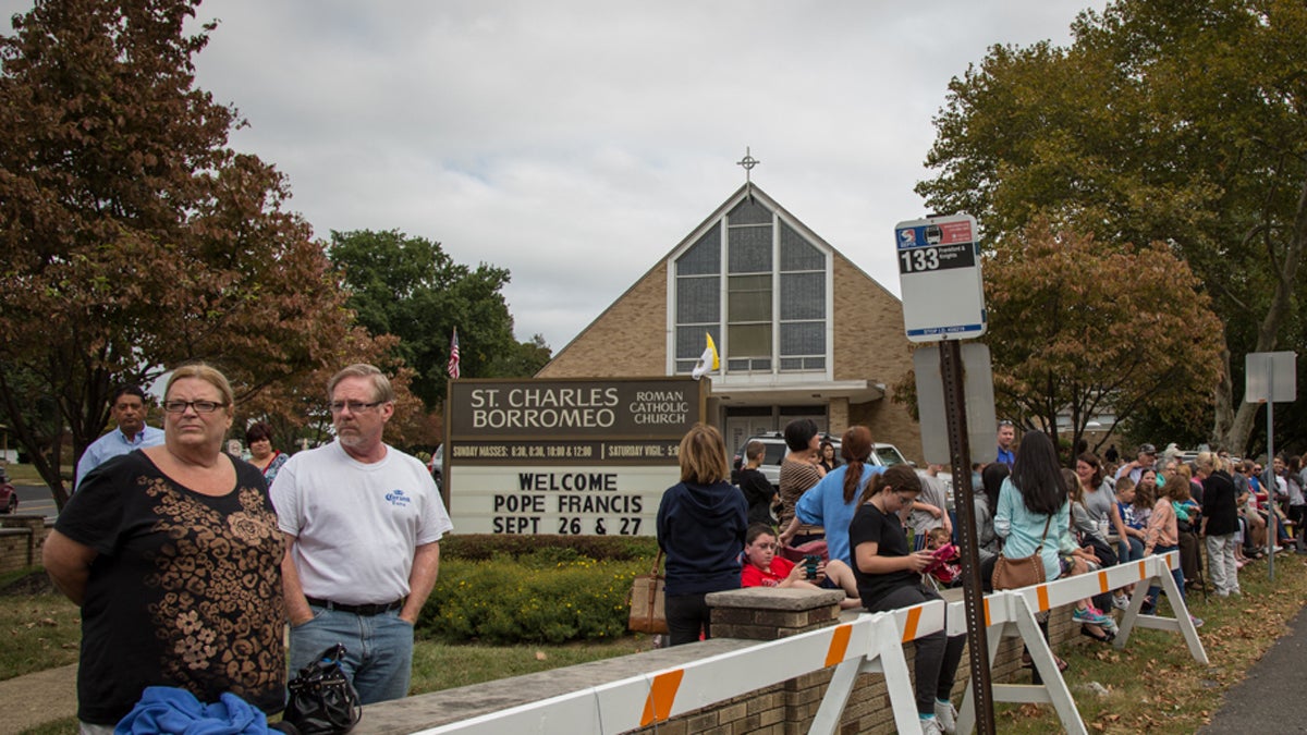  Locals gather across the street from the Shrine of St. Katharine Drexel in hopes that Pope Francis will stop by after praising the saint in his address the day before on the Ben Franklin Parkway. (Emily Cohen/for NewsWorks) 