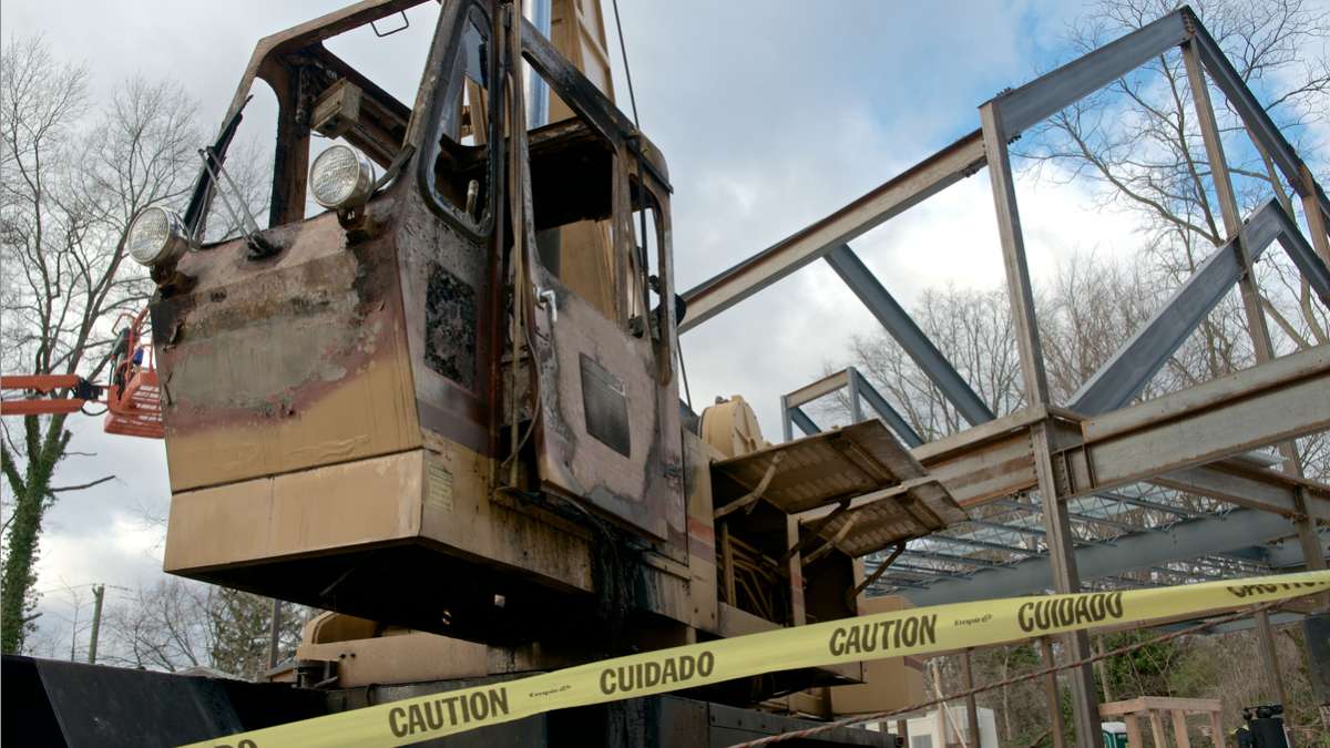  Signs of vandalism and arson are shown at the Chestnut Hill Meetinghouse site after a December 2012 fire. Prosecutors say this incident prompted an FBI investigation looking at union activities. (Bas Slabbers/for NewsWorks 