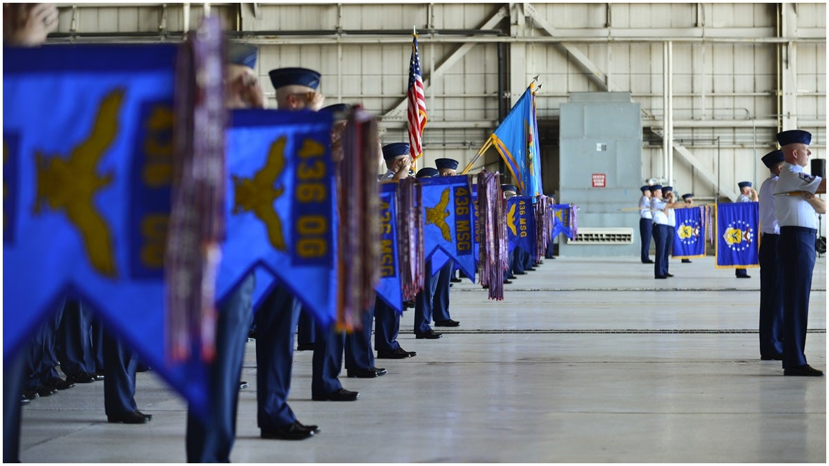  Squadron commanders present arms during a change of command ceremony Aug. 15, 2014, at Dover Air Force Base, Del. (U.S. Air Force photo/Airman 1st Class William Johnson) 