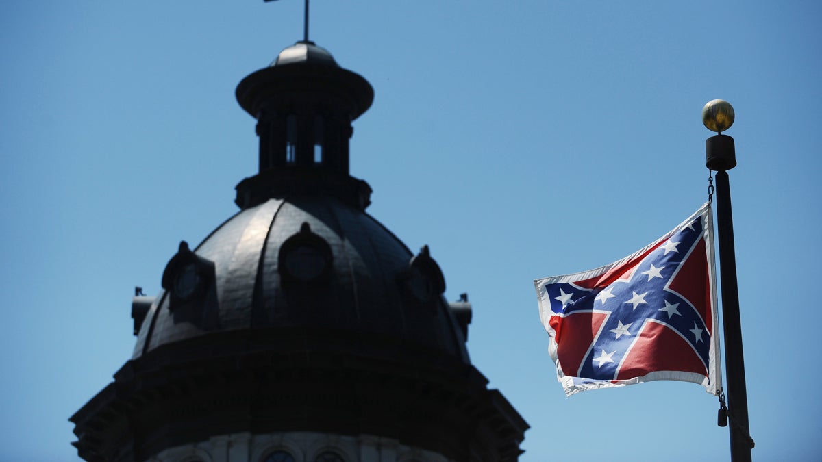  The Confederate flag flies near the South Carolina Statehouse, Friday, June 19, 2015, in Columbia, S.C. Tensions over the Confederate flag flying in the shadow of South Carolina’s Capitol rose this week in the wake of the killings of nine people at a black church in Charleston, S.C. (AP Photo/Rainier Ehrhardt) 