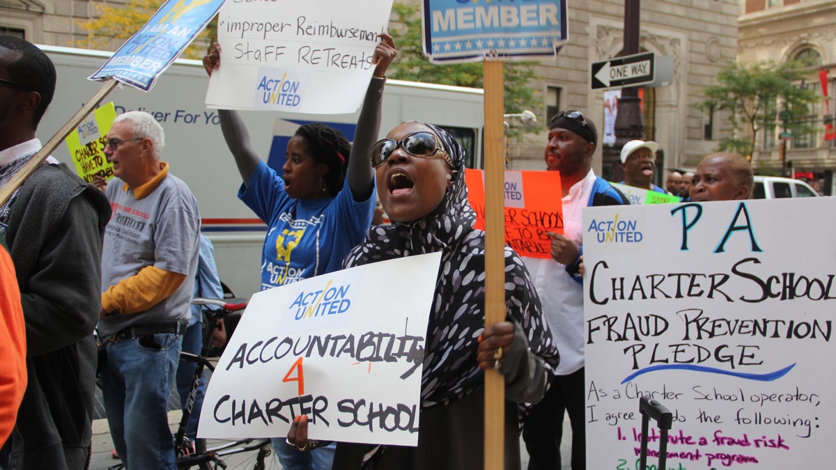  Members of Action United chant outside the Union League on Broad Street where Gov. Tom Corbett was lunching, The group delivered a report detailing $30 million lost to waste, fraud, and abuse at charter schools. (Emma Lee/WHYY) 