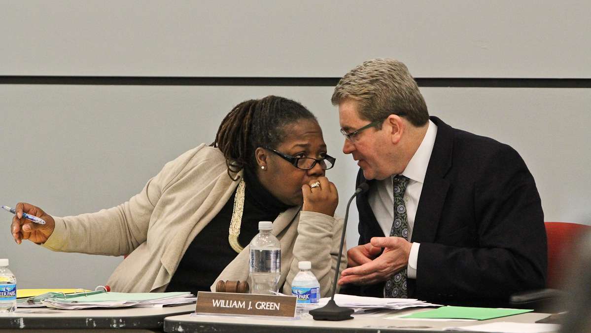  School Reform Commission members Sylvia Simms and Bill Green confer during hearings on charters school applications. Gov. Tom Wolf has said he's liked to dissolve the SRC, but not immediately.(NewsWorks file photo) 