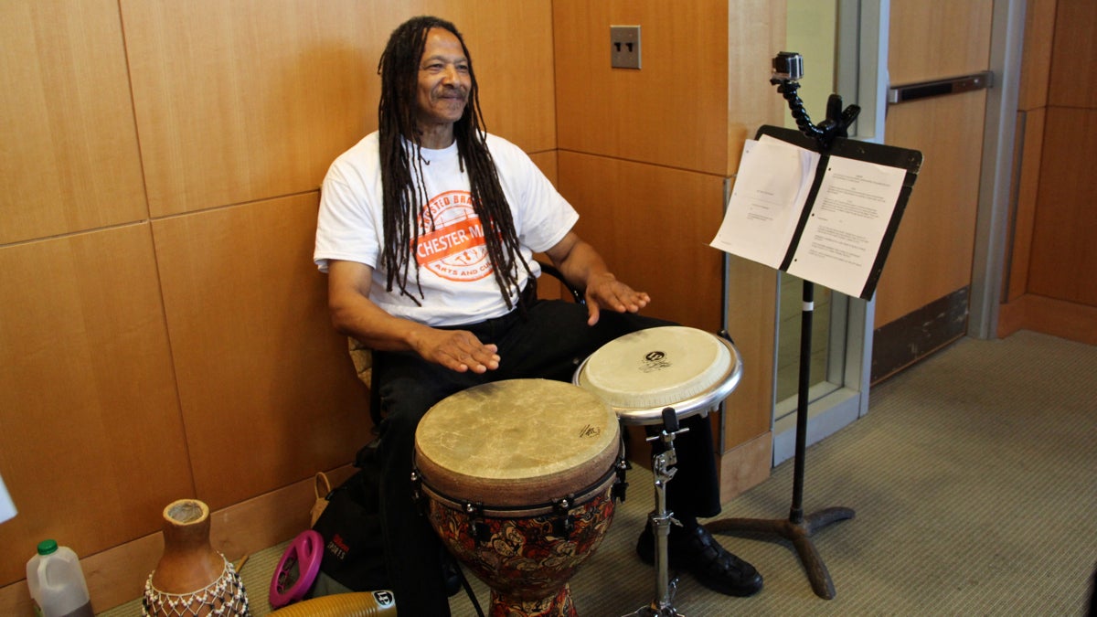 Lonnie Davis keeps the beat for the Chester Made Ensemble durin a performance at Chester City Hall. (Emma Lee/WHYY)