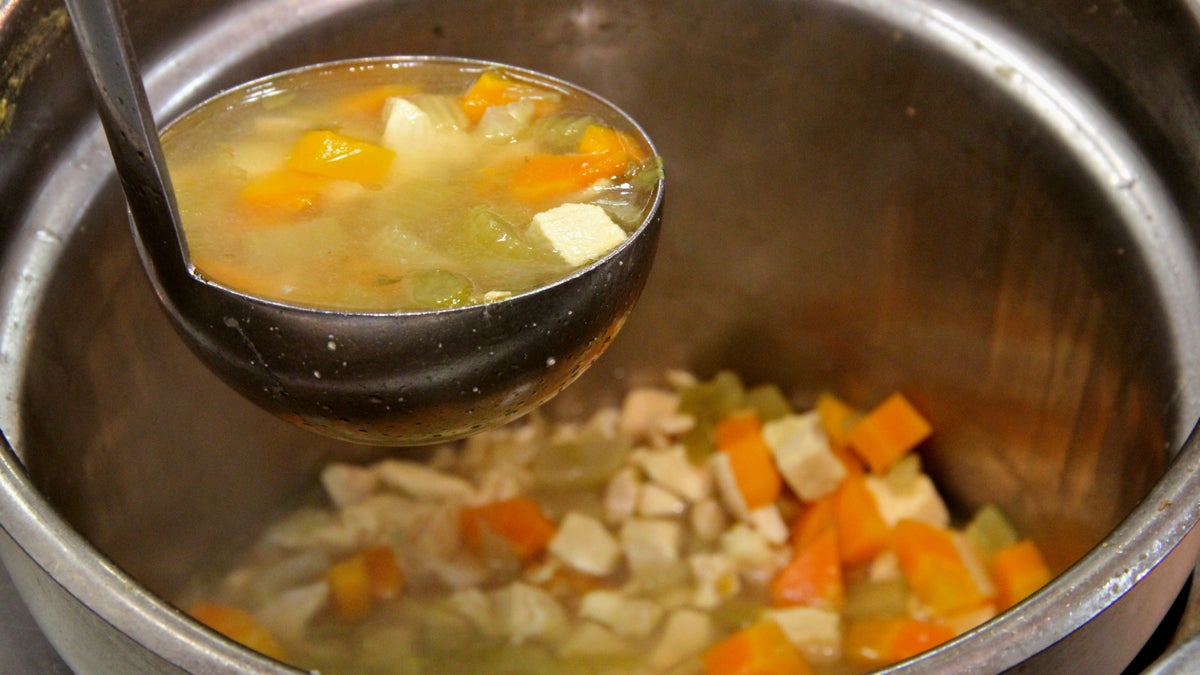 Chicken soup is served at Hershel's East Side Deli in Reading Terminal Market. (Emma Lee/WHYY)