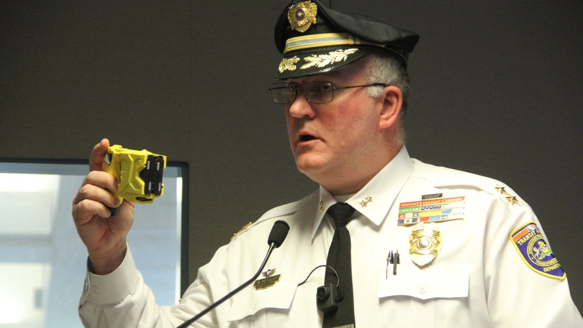  Chief of SEPTA Police Thomas Nestel holds a Taser like the one used on a combative suspect who later died in custody. (Emma Lee/WHYY) 