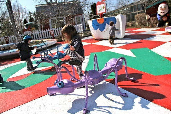 Children romp through a giant picnic