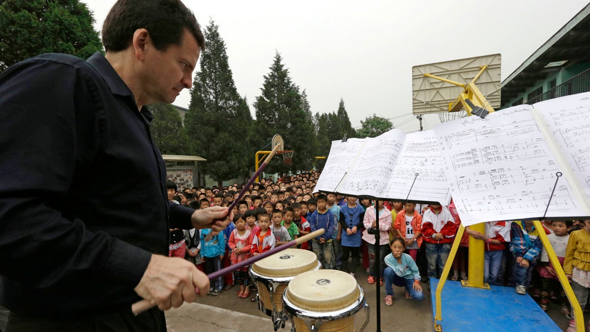 Christopher Deviney of the Philadelphia Orchestra performs as part of a outreach program to students at the Tongxin Experimental Primary School on the outskirts of Beijing