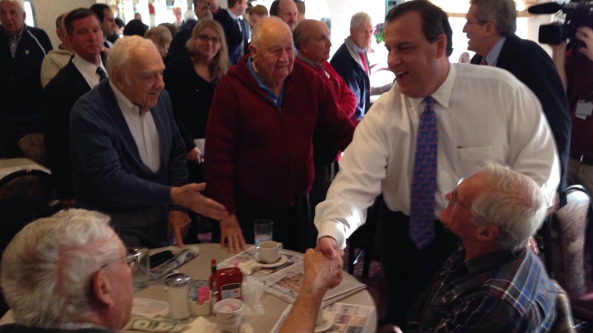  Gov. Chris Christie greets the breakfast crowd at the Morristown Diner Monday on a campaign swing for U.S. Senate candidate Jeff Bell. Republican Bell is running against incumbent Cory Booker. (John Abbott/for WHYY) 