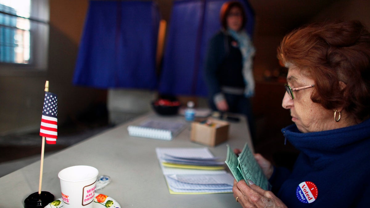 Voters sign in before casting their ballots at the Benjamin Franklin Elementary School in Northeast Philadelphia. (AP file photo) 