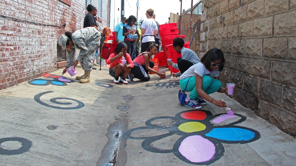 Neighborhood kids decorate a cleaned-up alley in the Patterson Park neighborhood of Baltimore on May 30. Photo courtesy of Leanna Wetmore from the Healthy Harbor Initiative.