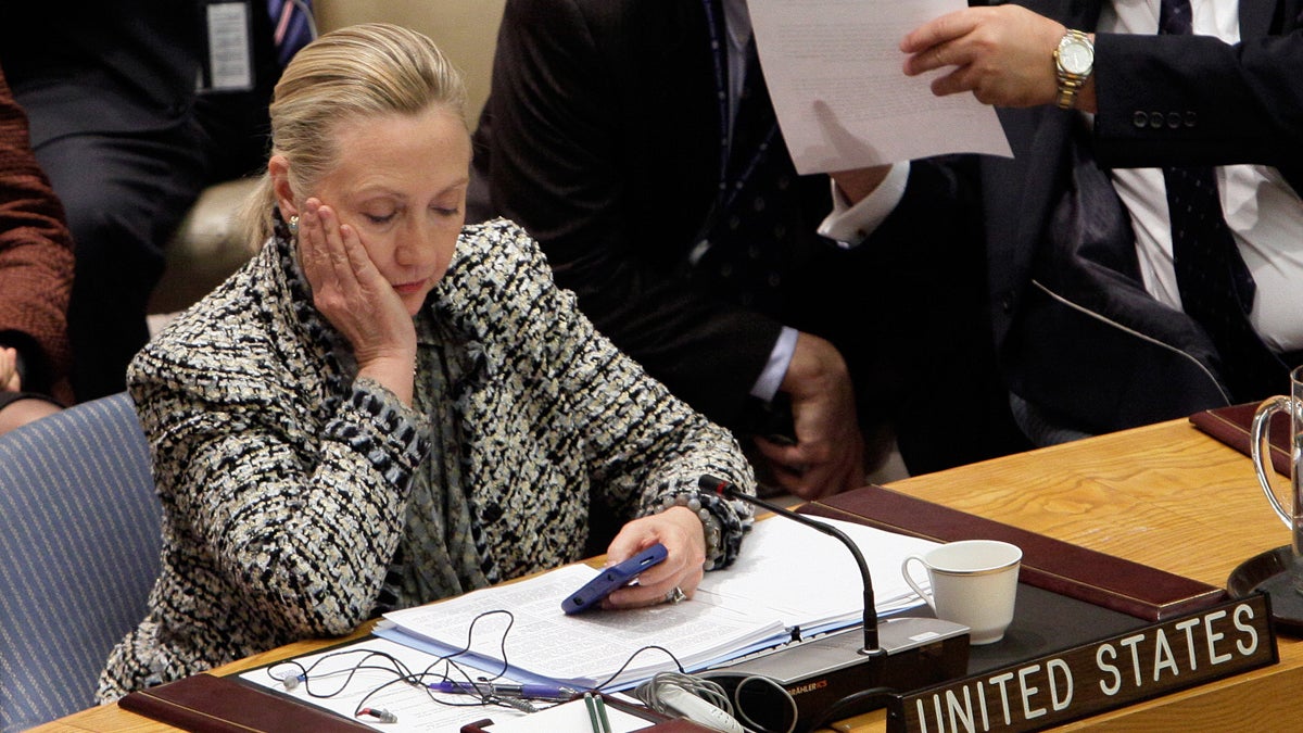 Then-Secretary of State Hillary Rodham Clinton is shown checking her mobile phone after her address to the Security Council at United Nations headquarters on March 12