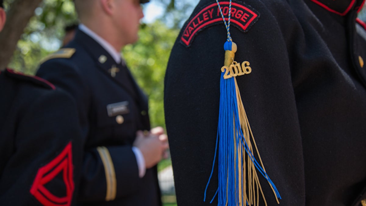 Cadets from the Valley Forge Military College hang their commencement tassels off of their uniforms for their graduation May 20th, 2016. (Emily Cohen for NewsWorks)